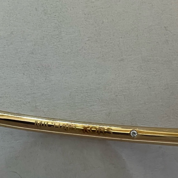 Michael Kors
Gold Tone/ Blue Arrow Open Cuff Lapis Stones Bracelet - Picture 4 of 4